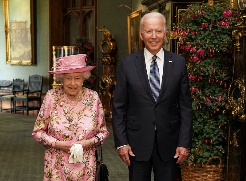 Queen Elizabeth with US President Joe Biden in the Grand Corridor during their visit to Windsor Castle in June 2021. Getty Images