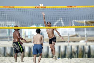 Dubai, United Arab Emirates, July 8, 2019.
FOR:  Standlone at  Jumeirah Kite Beach.--  Young men enjoy beach volleyball inbetween some dips in the sea.
Victor Besa/The National
Section:  NA
Reporter: