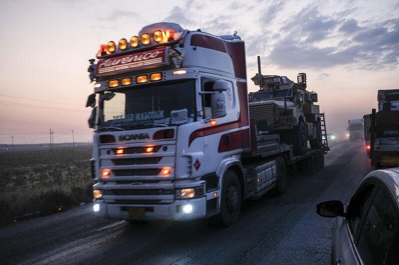 A convoy of U.S. armored military vehicles leave Syria on a road to Iraq. Getty Images