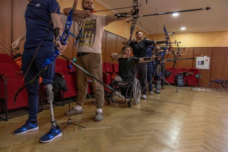 A Ukrainian amputee military veteran, 23, who lost his legs during shelling near Bakhmut, takes part in archery training in Kyiv ahead of an international contest. AFP