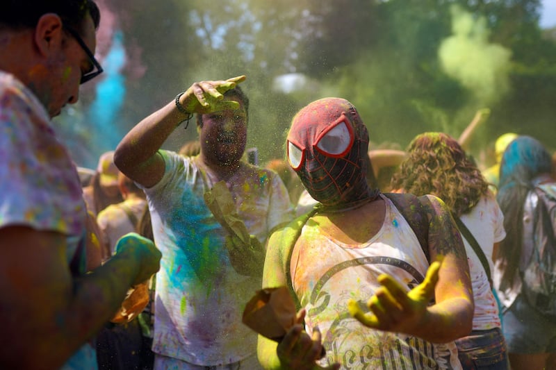Salvadorans play Holi at a festival organised by the Embassy of India with the support of El Salvador's Ministry of Culture, at Cuscatlan Park, San Salvador. AFP