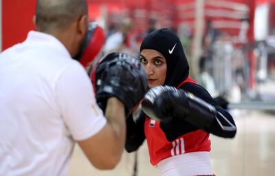 ABU DHABI,  UNITED ARAB EMIRATES , JUNE 16 – 2019 :- Mohammed Al Shebli , National team coach giving boxing training  to Fahima Falaknaz ( right )  at the UAE Boxing Federation HQ located at the Zayed Sports City Football stadium in Abu Dhabi. ( Pawan Singh / The National ) For Sport. Story by Amith