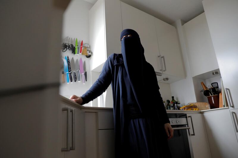 Ayah, 37, wears her niqab in her apartment on the first day of the implementation of the Danish face veil ban in Copenhagen, Denmark, August 1, 2018.  REUTERS/Andrew Kelly