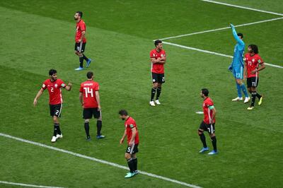 epa06810225 Dejected players of Egypt after conceding a goal during the FIFA World Cup 2018 group A preliminary round soccer match between Egypt and Uruguay in Ekaterinburg, Russia, 15 June 2018.

(RESTRICTIONS APPLY: Editorial Use Only, not used in association with any commercial entity - Images must not be used in any form of alert service or push service of any kind including via mobile alert services, downloads to mobile devices or MMS messaging - Images must appear as still images and must not emulate match action video footage - No alteration is made to, and no text or image is superimposed over, any published image which: (a) intentionally obscures or removes a sponsor identification image; or (b) adds or overlays the commercial identification of any third party which is not officially associated with the FIFA World Cup)  EPA/MAHMOUD KHALED   EDITORIAL USE ONLY
