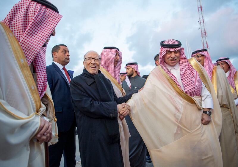 King Salman is welcomed by President Essebsi upon his arrival. EPA