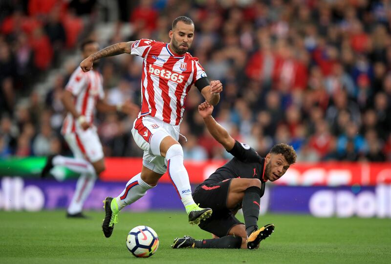 Stoke City's Jese Rodriguez (left) and Arsenal's Alex Oxlade-Chamberlain battle for the ball during the Premier League match at the bet365 Stadium, Stoke. PRESS ASSOCIATION Photo. Picture date: Saturday August 19, 2017. See PA story SOCCER Stoke. Photo credit should read: Mike Egerton/PA Wire. RESTRICTIONS: EDITORIAL USE ONLY No use with unauthorised audio, video, data, fixture lists, club/league logos or "live" services. Online in-match use limited to 75 images, no video emulation. No use in betting, games or single club/league/player publications.
