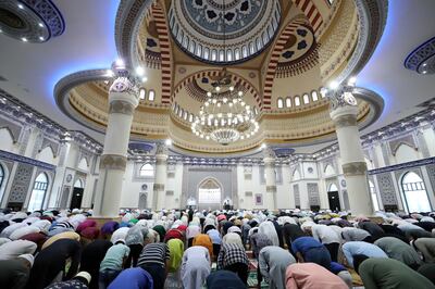 People pray at Al Farooq Omar Bin Al Khattab Mosque on Eid Al Adha. Chris Whiteoak / The National