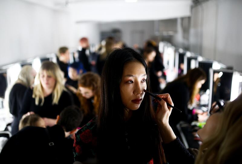 Models prepare backstage of the Yuhan Wang catwalk show at London Fashion Week in London, Britain. Reuters