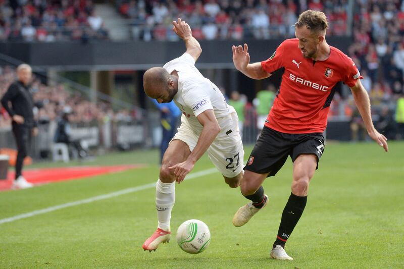 Tottenham's Brazilian forward Lucas Moura fights for the ball with Rennes' French forward Flavien Tait. AFP