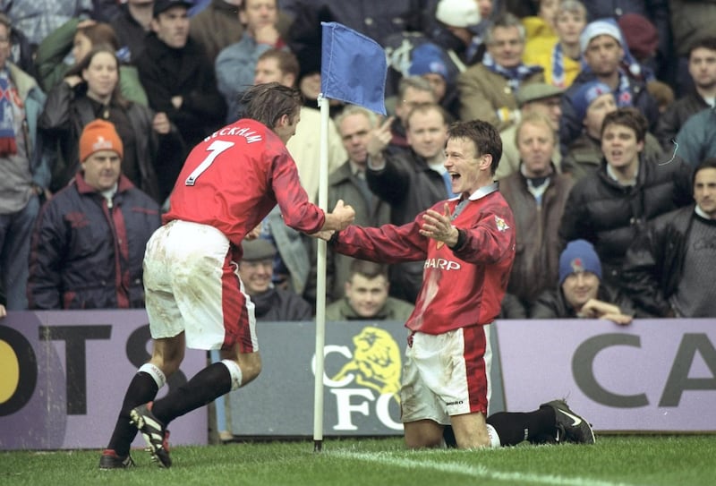 4 Jan 1998:  David Beckham of Manchester United (left) congratulates his team mate, Teddy Sheringham after he scored a goal during the FA Cup round three tie against Chelsea at Stamford Bridge in Chelsea, London. Manchester United won the match 3-5. \ Mandatory Credit: Shaun Botterill /Allsport