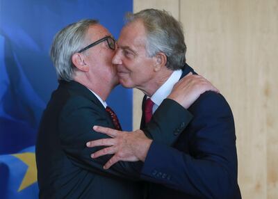 epa06173376 Former British Prime Minister Tony Blair is welcomed by European Commission President Jean Claude Juncker (L) prior to their meeting in Brussels, Belgium, 31 August 2017.  EPA/OLIVIER HOSLET