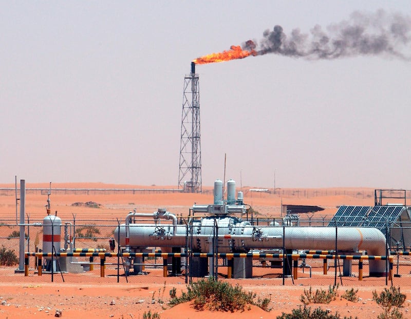 epa07569526 (FILE) - An image showing a gas flame behind pipelines in the desert at Khurais oil field, about 160 km from Riyadh, Kingdom of Saudi Arabia, 23 June 2008 (reissued 14 May 2019). Reports on 14 May 2019 state Saudi Aramco said some of its oil infrastructure in Saudi Arabia's eastern province has been attacked, including one of its petroleum pumping stations that was targeted by apparent armed drone attack.  EPA/ALI HAIDER *** Local Caption *** 90020213
