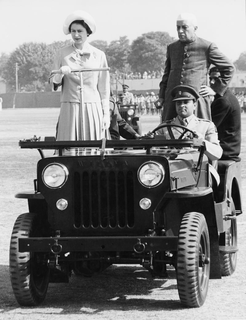 Queen Elizabeth II  inspects a rally of the Indian National Cadet Corps, accompanied by Indian Prime Minister Jawaharlal Nehru in Delhi, January 1961. Getty Images