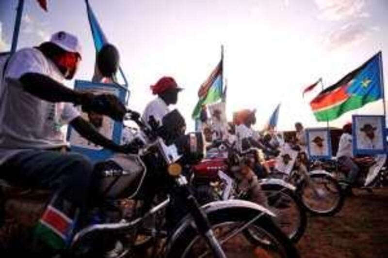 Supporters of current south Sudan leader and head of the SPLM, Sudanese Vice President Salva Kiir, ride their decked out motor bikes after a political rally in Juba on April 9, 2010. Sudanese President Omar al-Beshir and his remaining challengers addressed supporters on the last day of campaigning for elections that have been overshadowed by opposition boycotts. The southern former rebel Sudan People's Liberation Movement said it was withdrawing from simultaneous parliamentary and state elections in all northern states except the disputed Blue Nile and south Kordofan districts, after its candidate, Yasser Arman, pulled out of the presidential race.        AFP PHOTO/ROBERTO SCHMIDT *** Local Caption ***  267742-01-08.jpg