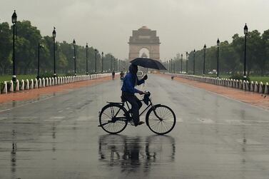 An Indian cyclist crosses Rajpath in New Delhi. The recovery by the world’s third-biggest crude consumer could help to consolidate this week’s rally in oil prices after a Covid-19 vaccine breakthrough.  AFP