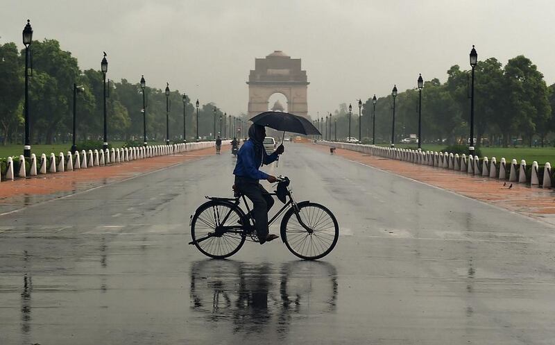 An Indian cyclist crosses Rajpath in New Delhi. The recovery by the world’s third-biggest crude consumer could help to consolidate this week’s rally in oil prices after a Covid-19 vaccine breakthrough.  AFP