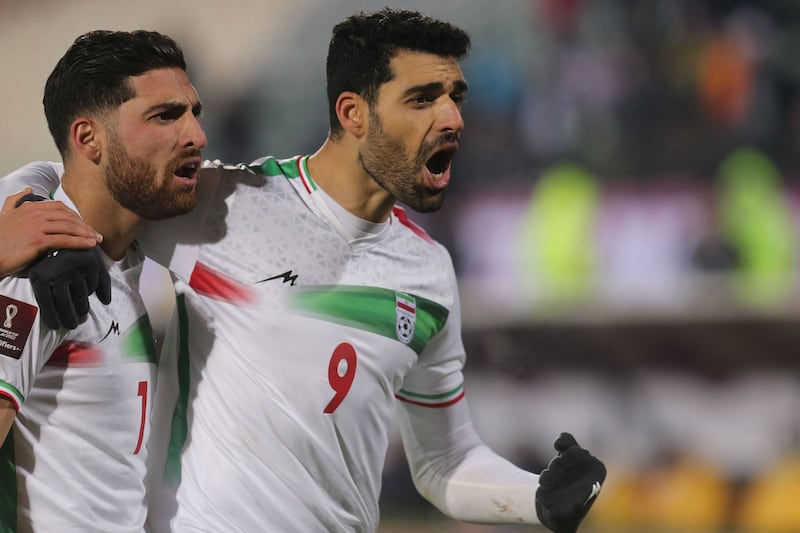 Iran's forward Mehdi Taremi, right, celebrates his opening goal with his teammates. AFP