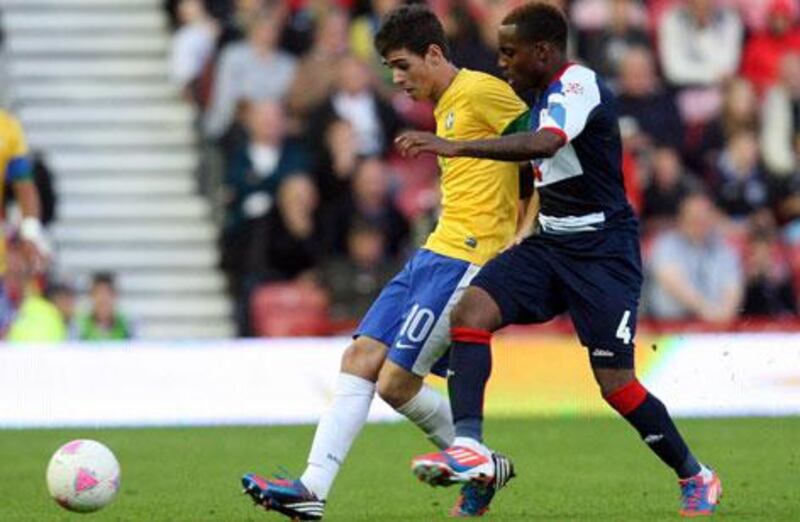 Danny Rose challenges new Chelsea signing Oscar during Team GB's pre-Olympics warm-up match