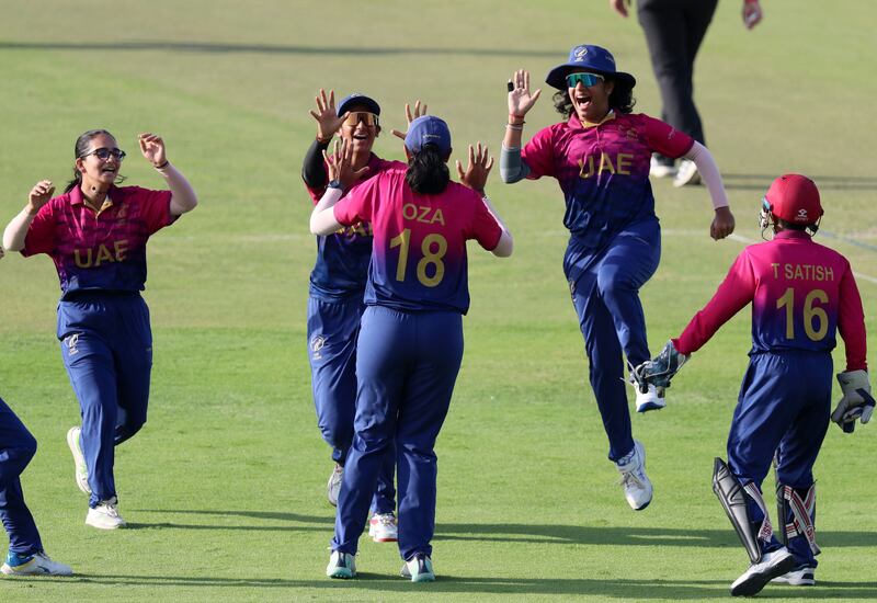 UAE's Esha Oza celebrates after bowling Ireland captain Laura Delany for a second-ball duck