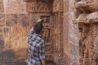 Carvings depict scenes of women getting ready, men preparing for war, musicians, animals and celestial beings. Taniya Dutta / The National