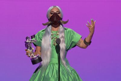 TOPSHOT - This handout image released courtesy of MTV shows US singer-songwriter Lady Gaga accepting the award for Song of the Year for "Rain On Me" during the 2020 MTV Video Music Awards, being held virtually amid the coronavirus pandemic, broadcast on August 30, 2020 in New York. RESTRICTED TO EDITORIAL USE - MANDATORY CREDIT "AFP PHOTO / MTV " - NO MARKETING - NO ADVERTISING CAMPAIGNS - DISTRIBUTED AS A SERVICE TO CLIENTS
 / AFP / MTV / - / RESTRICTED TO EDITORIAL USE - MANDATORY CREDIT "AFP PHOTO / MTV " - NO MARKETING - NO ADVERTISING CAMPAIGNS - DISTRIBUTED AS A SERVICE TO CLIENTS
