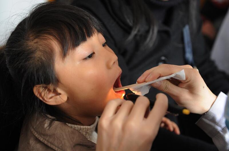 A Chinese child undergoes a check up at a hospital in Hefei in central China's Anhui province. Pneumonia is still the leading cause of death amongst Chinese children, according to a new study but the number of children in China who die before reaching the age of five has dropped by 70 per cent since 1990, mainly due to better medical care.