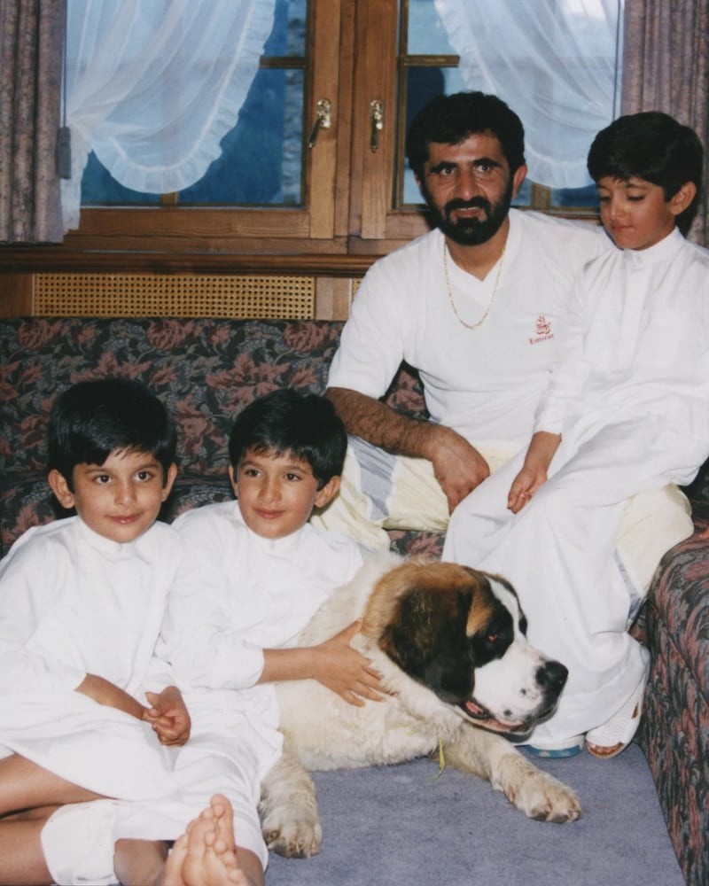 Sheikh Hamdan wit his father, Sheikh Mohammed bin Rashid, Vice President and Ruler of Dubai, and his siblings with their pet dog.