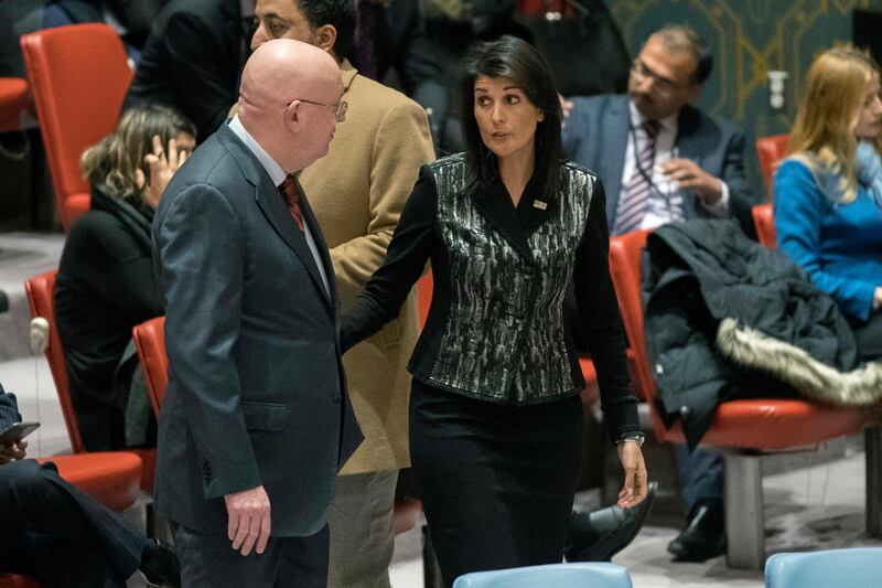 Russian Ambassador to the United Nations Vasily Nebenzya, left, speaks to American Ambassador to the United Nations Nikki Haley before a Security Council meeting on Iran, Friday, Jan. 5, 2018, at United Nations headquarters. (AP Photo/Mary Altaffer)