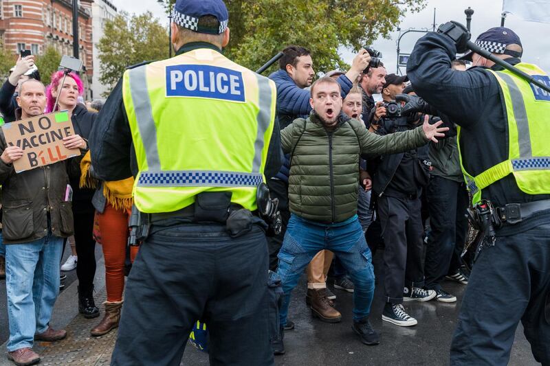 Anti-lockdown protesters clash with police during a demonstration against lockdown measures in Westminster, London.  EPA