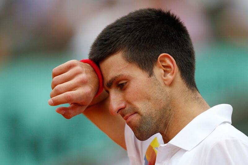 PARIS, FRANCE - JUNE 03:  Novak Djokovic of Serbia reacts during the men's singles semi final match between Roger Federer of Switzerland and Novak Djokovic of Serbia on day thirteen of the French Open at Roland Garros on June 3, 2011 in Paris, France.  (Photo by Matthew Stockman/Getty Images)