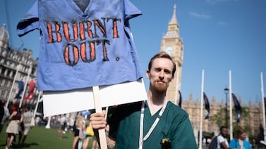A striking junior doctor from the British Medical Association takes part in a rally in Parliament Square, Westminster, during a 72-hour stoppage in a row with the Government over pay. Picture date: Friday June 16, 2023. PA