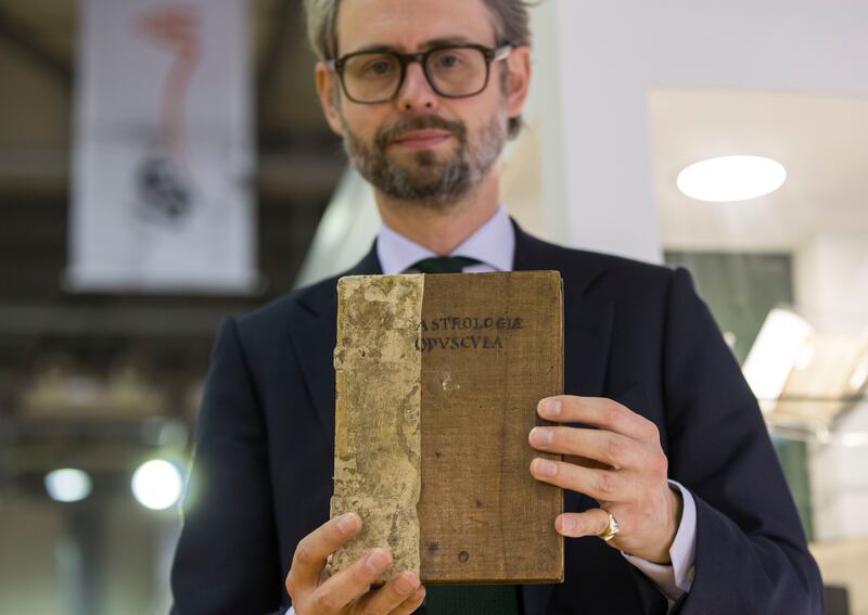 Ben Houston, sales director of Peter Harrington, with a rare copy of 'In Mutationes Aeris' by Firmin de Beauval.