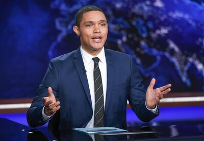 FILE - In this Sept. 29, 2015 file photo, Trevor Noah appears during a taping of "The Daily Show with Trevor Noah" in New York The new "Daily Show" host is finding his footing after a rough start replacing Jon Stewart, the man who made the broadcast essential. His comedy is sharper, he's becoming more comfortable with his adopted country and he's finding an audience of his own, even if smaller than his predecessor's.. (Photo by Evan Agostini/Invision/AP, File)