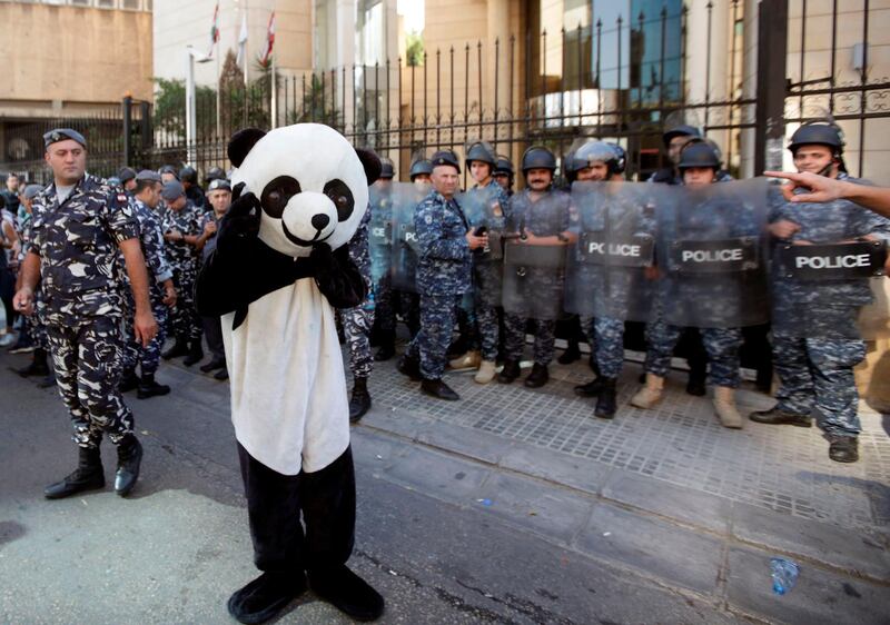 A Lebanese anti-government protester dressed in a panda suit takes part in demonstration outside the Lebanon Bar Associations in the capital Beirut. AFP