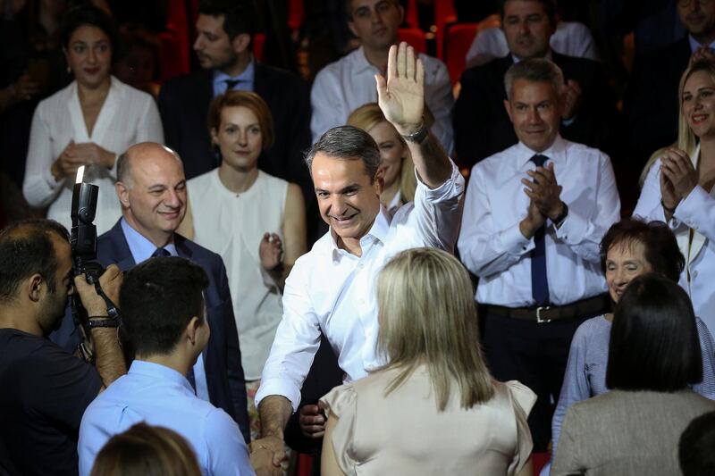 Leader of Greece's main opposition New Democracy conservative party Kyriakos Mitsotakis waves to supporters as he arrives to present his pre-election program in Athens, Greece June 21, 2019. REUTERS/Costas Baltas