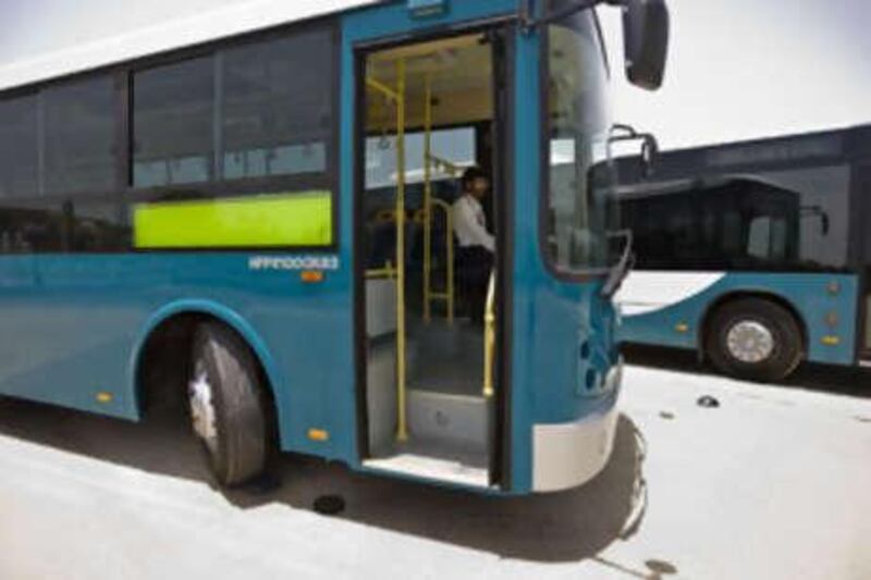 New buses are parked outside Emirates Palace on June 25 2008 as the Department of Transport unveils the bus service for Abu Dhabi.