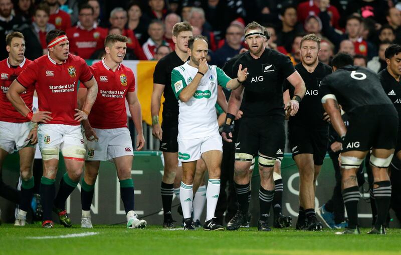 New Zealand captain Kieran Read, centre right, talks with referee Roman Poite at the end of the third and final Test between the British & Irish Lions and the All Blacks at Eden Park in Auckland, New Zealand, Saturday, July 8, 2017. The game ended in a 15 all draw and the series was tied at one Test all.