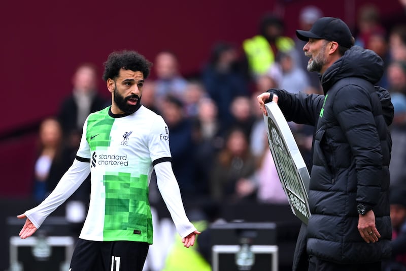 Mohamed Salah, left, and boss Jurgen Klopp argued on the touchline during Saturday's 2-2 draw at West Ham. Getty Images