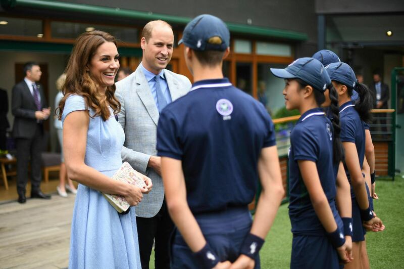 Britain's Prince William and Kate, Duchess of Cambridge meet ballboys and ballgirls, from left, Tom Hubner, 15, Rhianne Black, 14, Kayleigh Man, 13 and Cassius Hayman, 15, ahead of the Men's Singles Final on day thirteen of the Wimbledon Championships at the All England Lawn Tennis and Croquet Club, in London, Sunday, July 14, 2019. Photo: AP