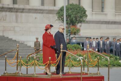 Queen Elizabeth II and Li Xiannian, the President of the People's Republic of China, standing outside the Great Hall of the People in Beijing during the Queen's visit to China in 1986. Fox Photos/Hulton Archive/Getty Images