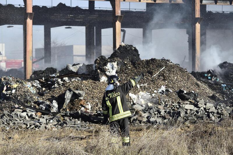Firefighters tackle a warehouse blaze in Corteolona e Genzone, near Pavia, northern Italy.  Flavio Lo Scalzo / EPA