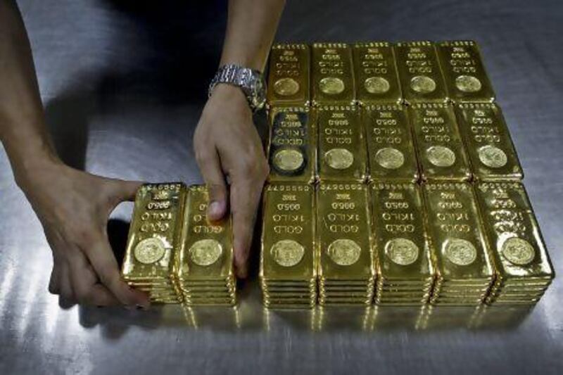 The massive increase in demand for smaller bars and coins is also responsible for the flood of new business in the Dubai gold market. Kamran Jebreili / AP Photo