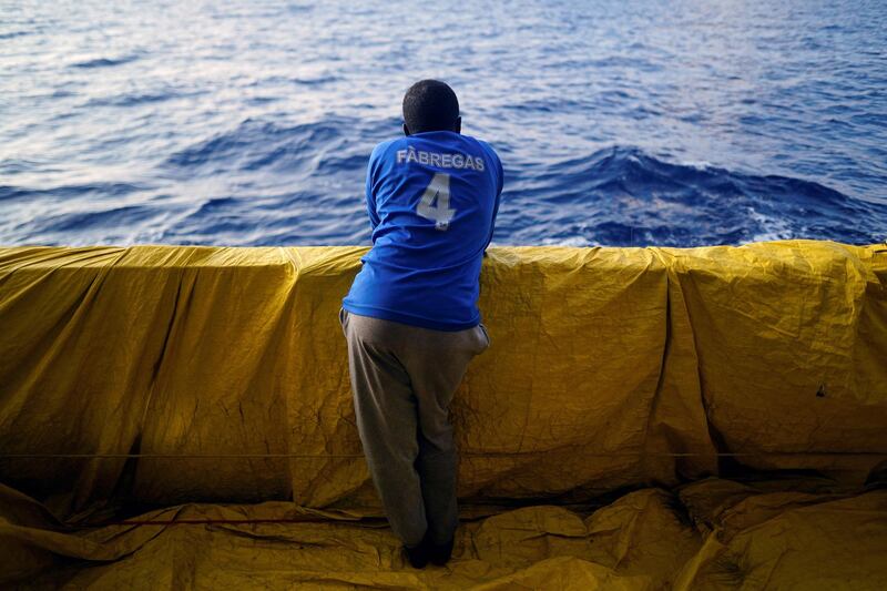 A migrant stands on board NGO Proactiva Open Arms rescue boat in central Mediterranean Sea. Juan Medina/Reuters
