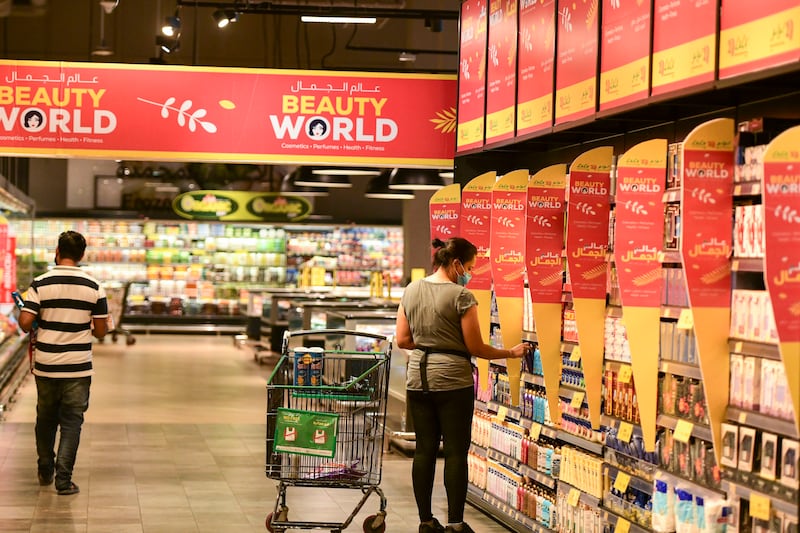 Shoppers look for discount buys at Lulu Hypermarket in Abu Dhabi. Khushnum Bhandari / The National
