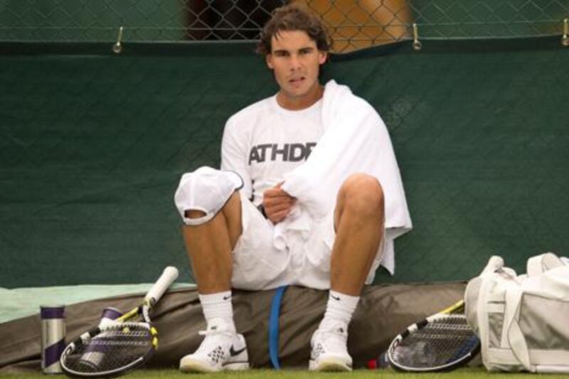 Rafael Nadal sits on the sidelines at Wimbledon, his last tournament of 2012.