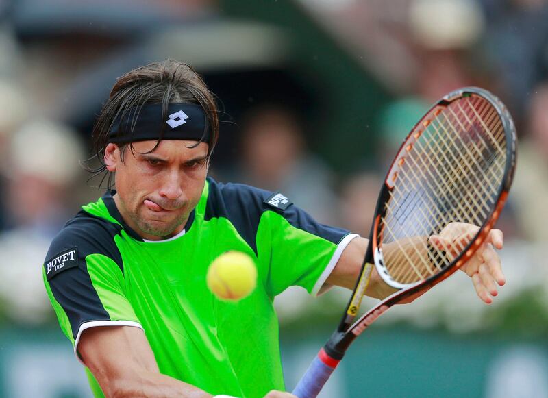 David Ferrer of Spain hits a return to compatriot Rafael Nadal during their men's singles final match at the French Open tennis tournament at the Roland Garros stadium in Paris June 9, 2013. Ferrer lost the match to Nadal.       REUTERS/Vincent Kessler (FRANCE  - Tags: SPORT TENNIS)   *** Local Caption ***  RGT917_TENNIS-OPEN-_0609_11.JPG