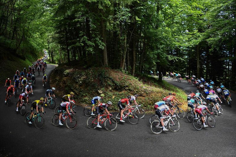 The pack rides in curves through a wood during the seventh stage of the Criterium du Dauphine cycling race, 133km between Saint-Genix-les-Villages and Les Sept Laux-Pipay.  AFP