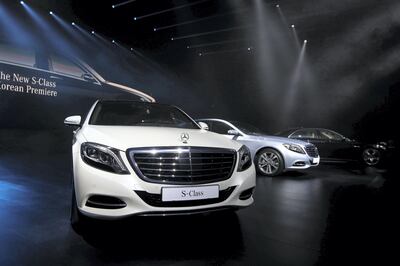 The new Mercedes-Benz S-Class S350, left, S500, center, and S63 AMG automobiles, manufactured by Daimler AG, sit on display as they are launched in Seoul, South Korea, on Wednesday, Nov. 27, 2013. Daimler plans to double sales in South Korea by 2020, and build a new research and development center, Daimler Chief Executive Officer Dieter Zetsche said today. Photographer: SeongJoon Cho/Bloomberg 