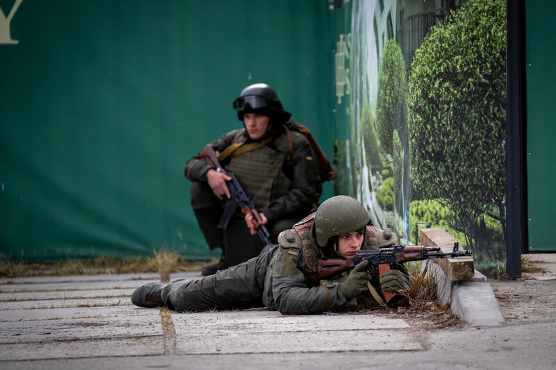 Ukrainian soldiers in downtown Kiev after Russian troops reached the outskirts of the capital. AP Photo