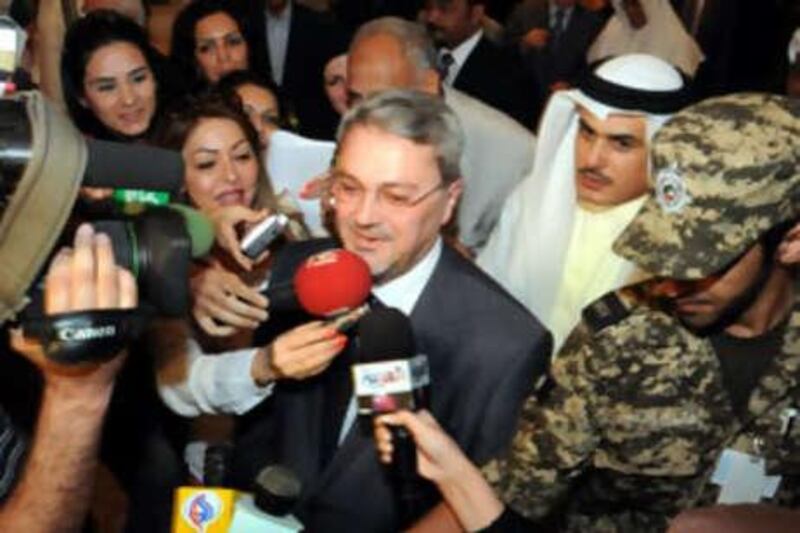 Mohammed Hussein Bahr al Ulum is swarmed by journalists on his arrival in Kuwait.